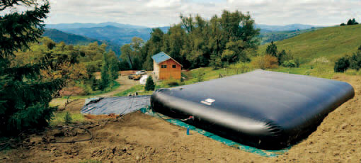 A Husky tank used for water storage at a cabin in the mountains