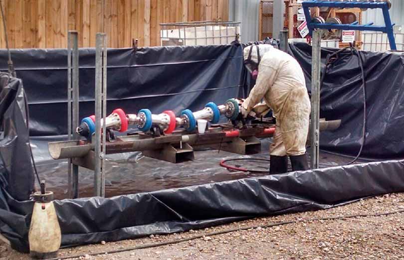A portable wash bay containing excess water and runoff from equipment being cleaned
