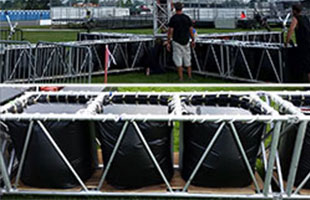 Husky Portable Tanks are used as a light tower ballast at a Rolling Stones concert